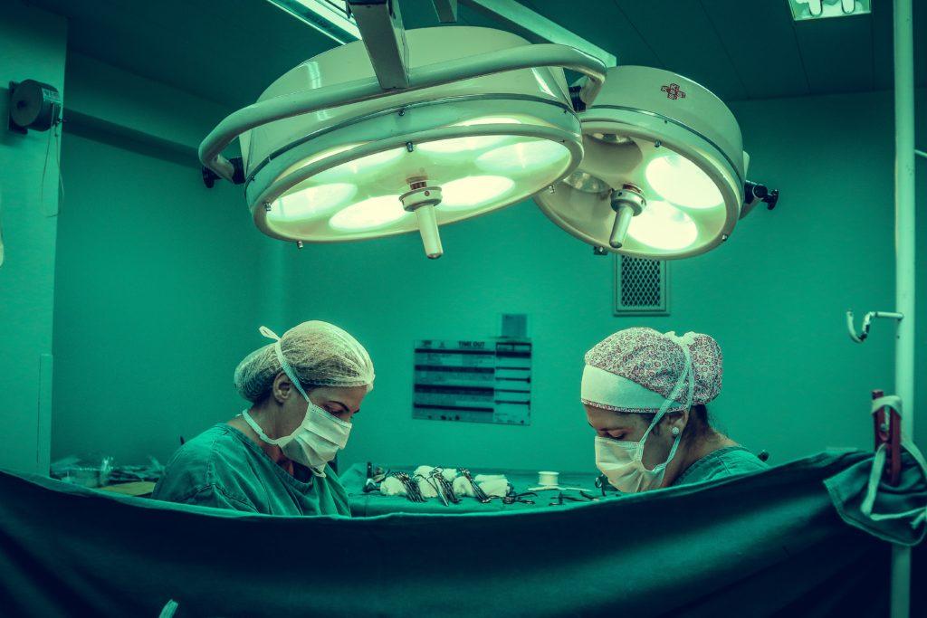 neurosurgeons perform a brain surgery