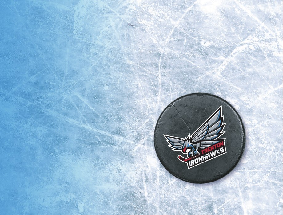 Hockey puck with the Trenton IronHawks logo on the ice